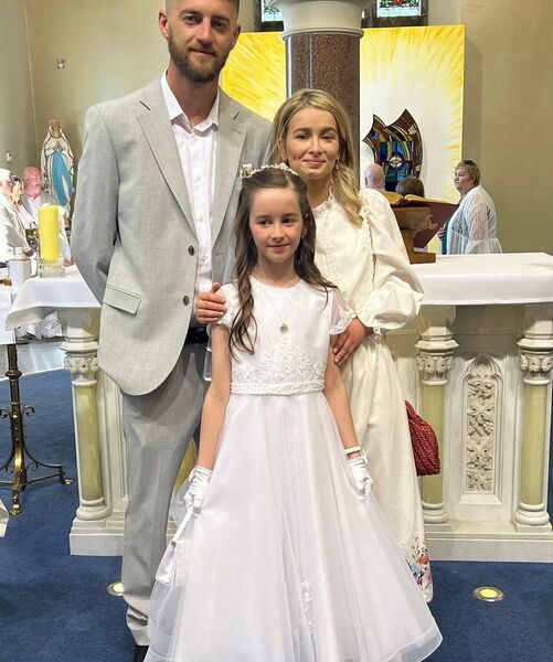 Angel, her fiancé Jordan and their daughter Ivy at Ivy's First Holy Communion. 
