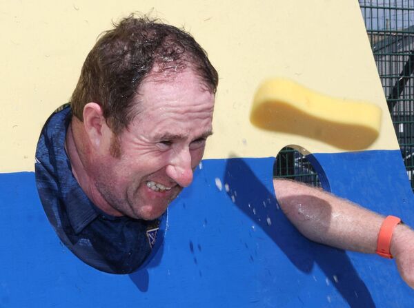 Keith Murphy, had his head in the stocks for the wet sponge, at the Sacred Heart Family Resource Centre, Fun Day. Photo: Joe Evans Keith Murphy, had his head in the stocks for the wet sponge, at the Sacred Heart Family Resource Centre, Fun Day. Photo: Joe Evans