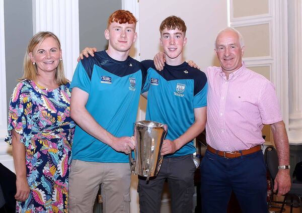 Waterford minor hurling team members, Jack and Andrew Power are pictured with the Irish Press cup and parents Catherine and Paul Power.