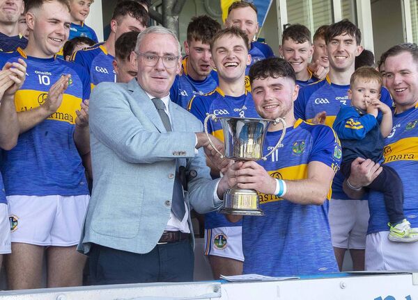 Neil Moore Chairman Waterford GAA Board presents the Cup to An Rinn’s Captain Caolan MacCraith after their Co. Intermediate hurling final win over Roanmore. Neil Moore Chairman Waterford GAA Board presents the Cup to An Rinn’s Captain Caolan MacCraith after their Co. Intermediate hurling final win over Roanmore.