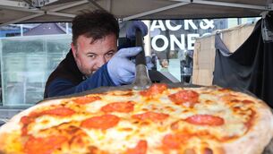 <p>Adriano Cavaliere, Azzurro, serving up home made wood fired pizza at Waterford Harvest Festival. Photo: Joe Evans</p>