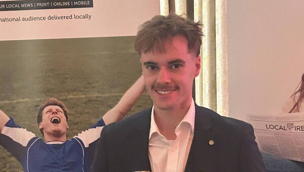 Waterford News &amp; Star journalist, Darragh Murphy, pictured with his two awards.