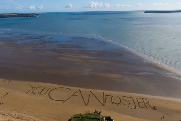Tusla foster families from Waterford and Wexford came together to create the world's largest ever sand message, 'You CAN foster' Photo: Nichola Browne-Sinnott