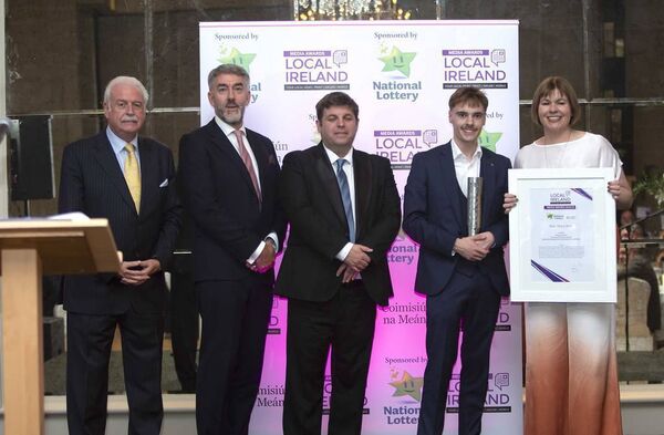 Waterford News and Star journalist Darragh Murphy, being presented with the trophy for Best News Story at the Local Ireland Media Awards.