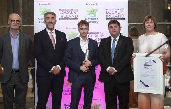 Waterford News and Star journalist, Darragh Murphy, being presented with the Young Journalist of the Year trophy at the Local Ireland Media Awards.