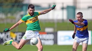<p>Kilrossanty's Tommy Prendergast fires a shot towards the An Rinn goal as Ben Qualter can only look on during the J.J. Kavanagh &amp; Sons Senior Football Championship clash played a Cappoquin Logistics Fraher Field. Photos: Eddie Dee </p>