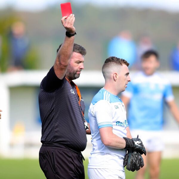 Roanmore's keeper Josh Sheridan is shown a red card by referee Eoin Morrissey. Roanmore's keeper Josh Sheridan is shown a red card by referee Eoin Morrissey.