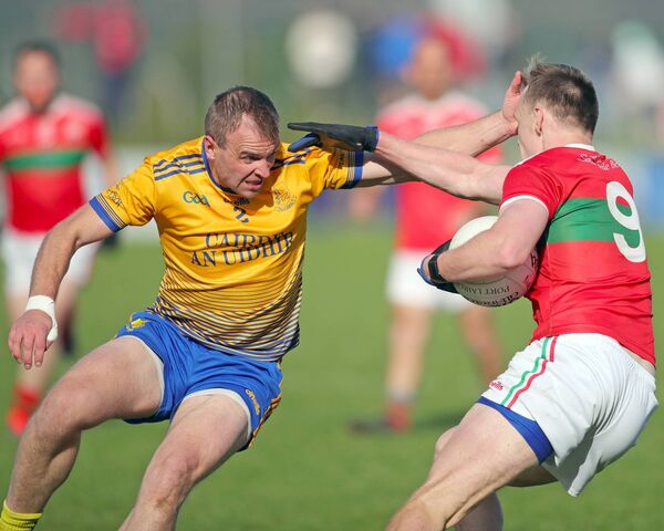 The Nire's James McGrath challenges Clashmore/Kinsalebegs Sam Fitzgerald.