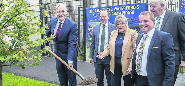 Taoiseach Micheal Martin plants a tree at Blackwater Community School, also pictured are Ministers John Cummins and Mary Butler, Denis Ring, Principal, and Declan Doocey, Outgoing Chairperson of the Board of Management. Photo: Sean Byrne