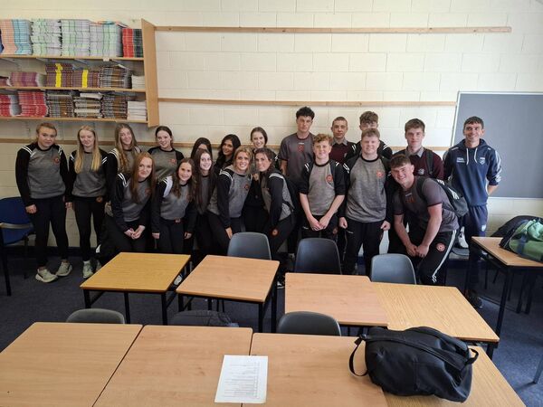 Gavin Whelan with two St Declan's TY groups who took part in a refereeing course.