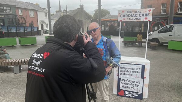 Anthony Kelly and Konor Halpin of the Southeast Cardiac Care Campaign, conducting interviews in Waterford city this week.