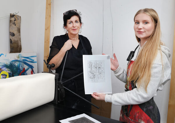 Artist Anne McDonnell with Nathalie at the Tetra Pak Print Workshop at GOMA Gallery for Culture Night. Photo: Joe Evans