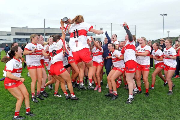De La Salle joint captains Keeley Corbett-Barry and Beth Carton celebrate with their team after the trophy presentation. De La Salle joint captains Keeley Corbett-Barry and Beth Carton celebrate with their team after the trophy presentation.