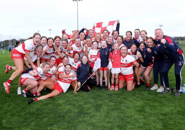 The De La Salle team, management and fans celebrate their senior camogie championship win on Saturday against Gailltir. The De La Salle team, management and fans celebrate their senior camogie championship win on Saturday against Gailltir.