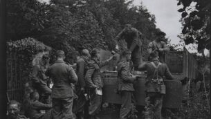 <p>Tea arriving at the ‘front line’ – Irish Army on manoeuvres between Waterford City and Tramore, August 1944. Image courtesy of The Military Archives</p>