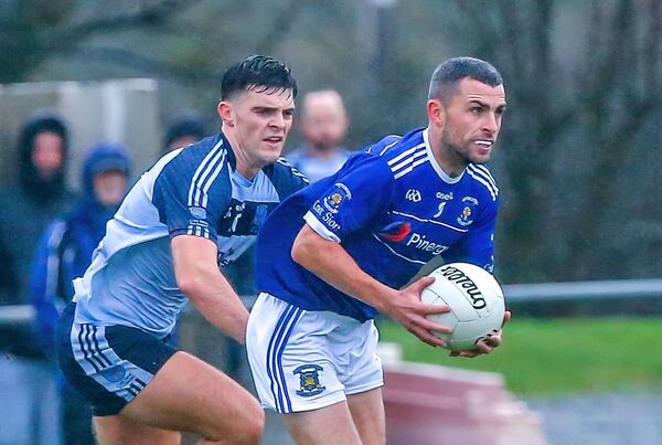 Mount Sion's Stephen Roche is tackled by Kilmacthomas's Colyn Power.