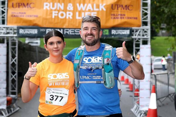 Anthony Keyes who ran seven marathons in seven days ending with the Solas Run is pictured at the finish line with his daughter Annabelle Keyes. Anthony Keyes who ran seven marathons in seven days ending with the Solas Run is pictured at the finish line with his daughter Annabelle Keyes.