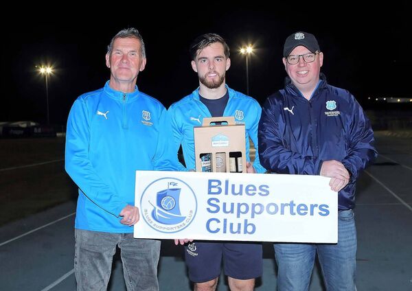 The Blues Supporters Club Player of the Month for September was Waterford FC's Ryan Burke and he is pictured receiving his prizes from Odhran Fitzgerald and Owen Power, Blues Supporters Club The Blues Supporters Club Player of the Month for September was Waterford FC's Ryan Burke and he is pictured receiving his prizes from Odhran Fitzgerald and Owen Power, Blues Supporters Club