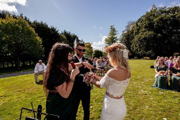 Photo: INFOKUS Eric's mother Maria Kiely made our handfasting chord for the ceremony