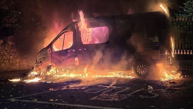 Fireworks launched at gardaí, Garda van set alight, in clash with protesters at Citywest