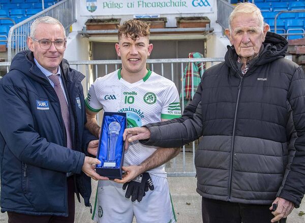 Ken Begley, J.J.Kavanagh & Sons, Sponsors aand Neil Moore, Chairman Co.GAA Board presents the Man of the Match Award to the Shamrocks Billy Hynes. Ken Begley, J.J.Kavanagh & Sons, Sponsors aand Neil Moore, Chairman Co.GAA Board presents the Man of the Match Award to the Shamrocks Billy Hynes.