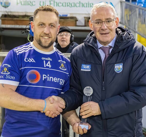 Neil Moore, Chairman Co. GAA Board presents the Man of the Match Award to Mount Sion's Gareth Duffy. Neil Moore, Chairman Co. GAA Board presents the Man of the Match Award to Mount Sion's Gareth Duffy.
