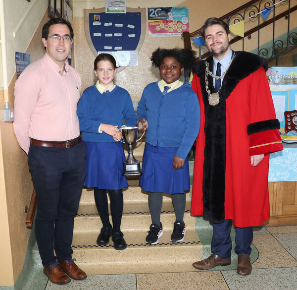  Metropolitan Mayor of Waterford Cllr. Adam Wyse, annual school visits and presented the best attendance cup to Anna and Timi on behalf of fourth class, alsi in photo is Principal Jamie Nagel. Photo: Joe Evans