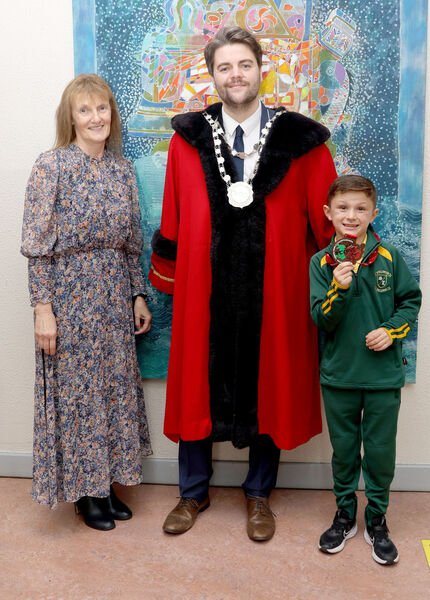  Metropolitan Mayor of Waterford Cllr. Adam Wyse, annul school visits, when he visited Scoil Lorcain, Willie O'Reilly show him the bronze medal he won in Kickboxing tournament held in Swansea, also in photo id Principal Caroline Douris. Photo: Joe Evans