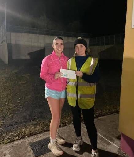 The winner of the Touraneena Runners Club 'Lucky Dip', Week 5 is presented with her prize The winner of the Touraneena Runners Club 'Lucky Dip', Week 5 is presented with her prize