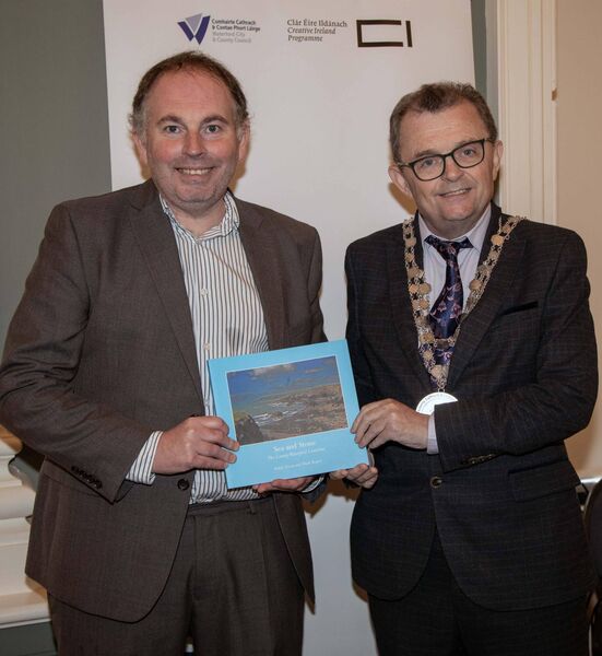 Mayor Seamus Ryan presenting a copy of 'Sea and Stone' to SETU Librarian Kieran Cronin, speaker at the Waterford-Newfoundland Heritage Connections Seminar in City Hall. Photo: John Power