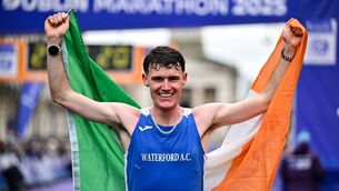 <p>David McGlynn of Waterford AC crosses the finish line to win the men's national title at the 2025 Irish Life Dublin Marathon. Photo: Sportsfile/Sam Barnes</p>