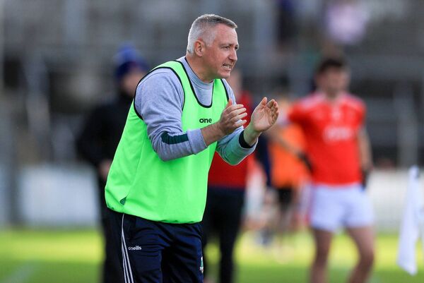 Rathgormack Manager Kenny Hassett cheers his side on in the AIB Munster Senior Club Football Championship Quarter-Final in Cusack Park, Ennis