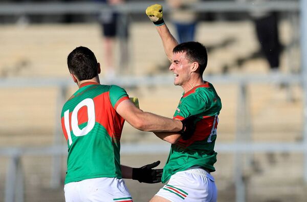 Rathgormack’s Stephen Curry celebrates his goal with Frances Roche midway through the first half. Photos: ©INPHO/Natasha Barton