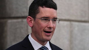 Man choked his wife in front of young children, court hears