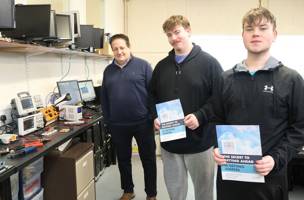 Computer Systems and Network tutor, Pierce Fewer with Youth Reach students, Joe and Tommy. Computer Systems and Network tutor, Pierce Fewer with Youth Reach students, Joe and Tommy.