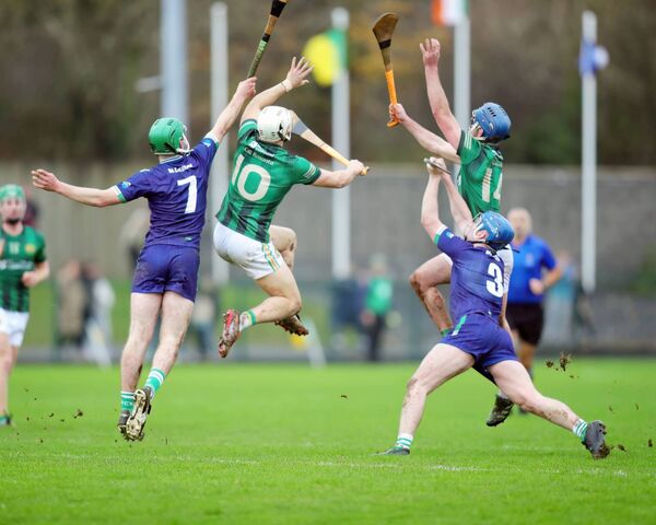 Players compete under the high ball during the Munster Club Championship this past weekend.