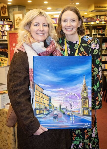 Artist Lisa Keane and Lisa Connolly, The Book Centre, with the original painting created by Lisa Keane for the cover of Festive Star 2025. Photo: Joe Evans Artist Lisa Keane and Lisa Connolly, The Book Centre, with the original painting created by Lisa Keane for the cover of Festive Star 2025. Photo: Joe Evans