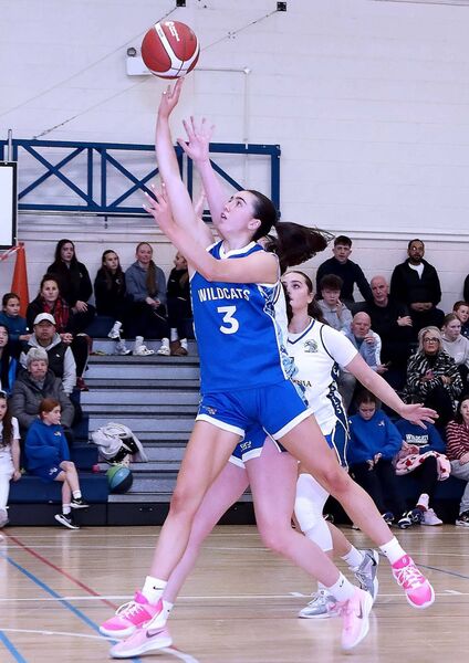 Kate Hickey shows her class as she stretches to score for the Wildcats during the second quarter. Kate Hickey shows her class as she stretches to score for the Wildcats during the second quarter.