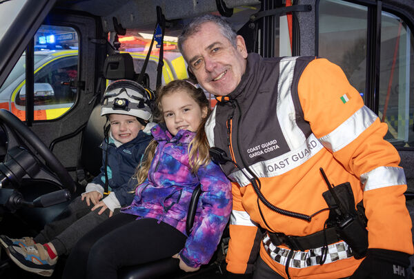  Luke and Hailey with Irish Coast Guard member Fran Conroy at the Winterval Blue Light Parade.