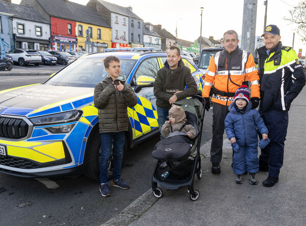  Frank, Shay, Bruno and Conor with Fran Conroy, Irish Coast Guard, and Garda Ollie O'Flynn, at the Winterval Blue Light Parade.