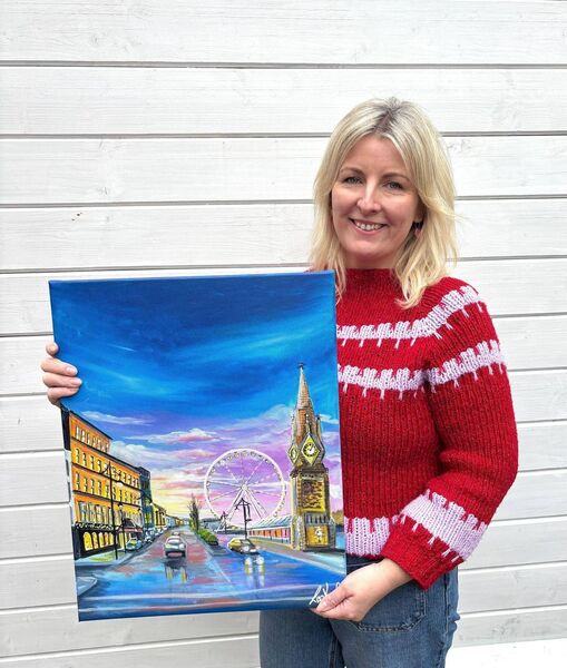 Artist Lisa Keane with the cover painting she created for this year's Festive Star Christmas Annual.