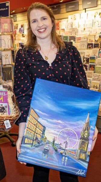 Mary Frances Ryan, Editor, Waterford News &amp; Star with the painting that graces the front of Festive Star. Photo: Joe Evans