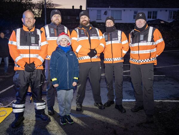 Sean with members of the Irish Coast Guard, at the Winterval Blue ight Parade. Photo: Joe Evans Sean with members of the Irish Coast Guard, at the Winterval Blue ight Parade. Photo: Joe Evans