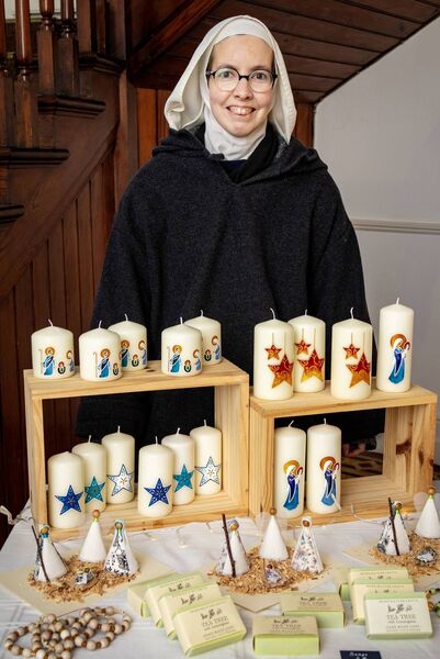 Sr. Angela with her hand-painted candles. 	Photos: Joe Evans