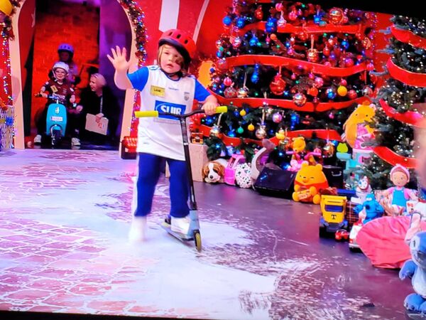 Waterford scoots on through the Toy Show studio during the parade of Irish counties.