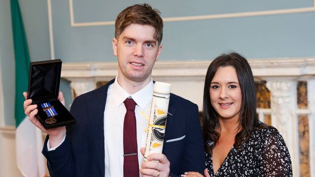 <p>Sergeant Fergal O’Connor is awarded a Bronze medal and a Certificate of Bravery for his actions at the National Bravery Awards 2025. Pictured with with Jenny O'Connor. Picture Credit: An Garda Síochána Waterford Facebook page. </p>