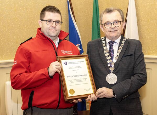 Pictured at City Hall, where Mayor of Waterford City &amp; County Cllr. Seamus Ryan held a reception for Order of Malta Tramore Unit, in recognition of their 80 years dedicated service, ofering medical care, emergency relief and compassionate support to those in need, Derek O'Brien. accepted the scroll on behalf of the Unit Photo: Joe Evans