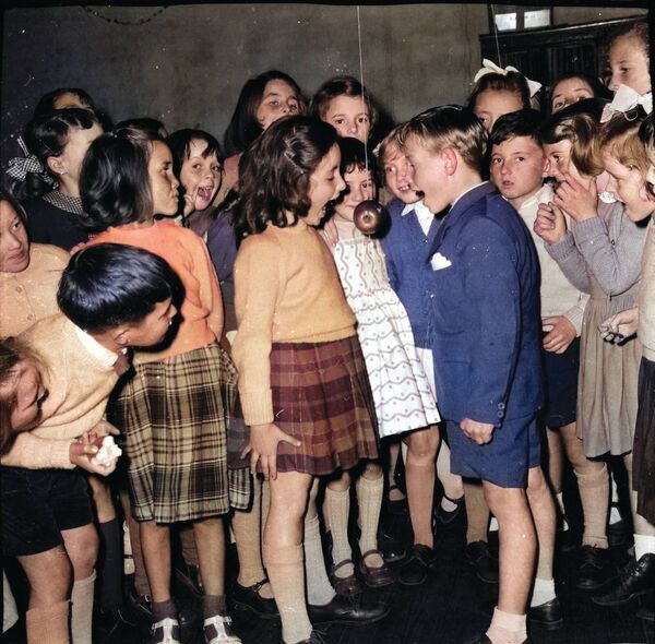 Mary O'Shea and Jimmy Leech were having a snap at the apple at the 1961 Sisters of Charity, Lady Lane, Halloween Party.