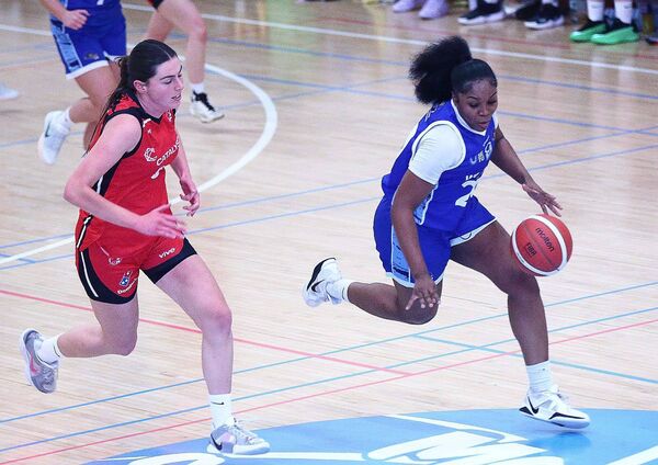Wildcats Tiarra Brown glides past Fr. Matthews Abby Murphy.
