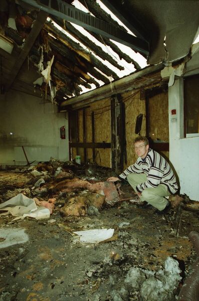 Project Manager for Focus Ireland's Ballytruckle housing development, David Niblock, surveys the damage caused by vandals who destroyed the newly constructed Community Centre by setting it alight back in 2000.